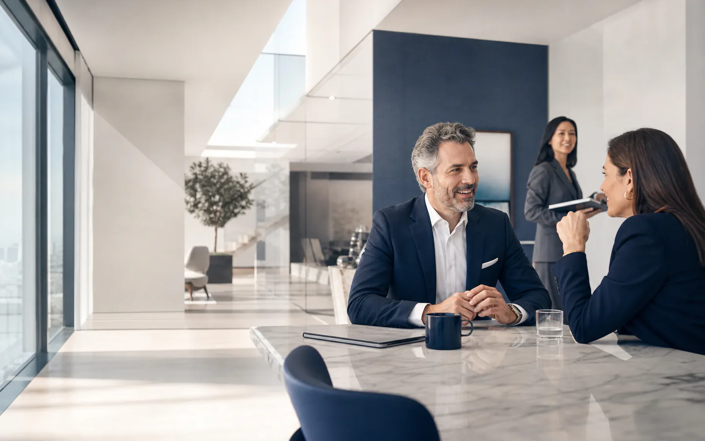 Business leaders having a collaborative conversation in a bright office
