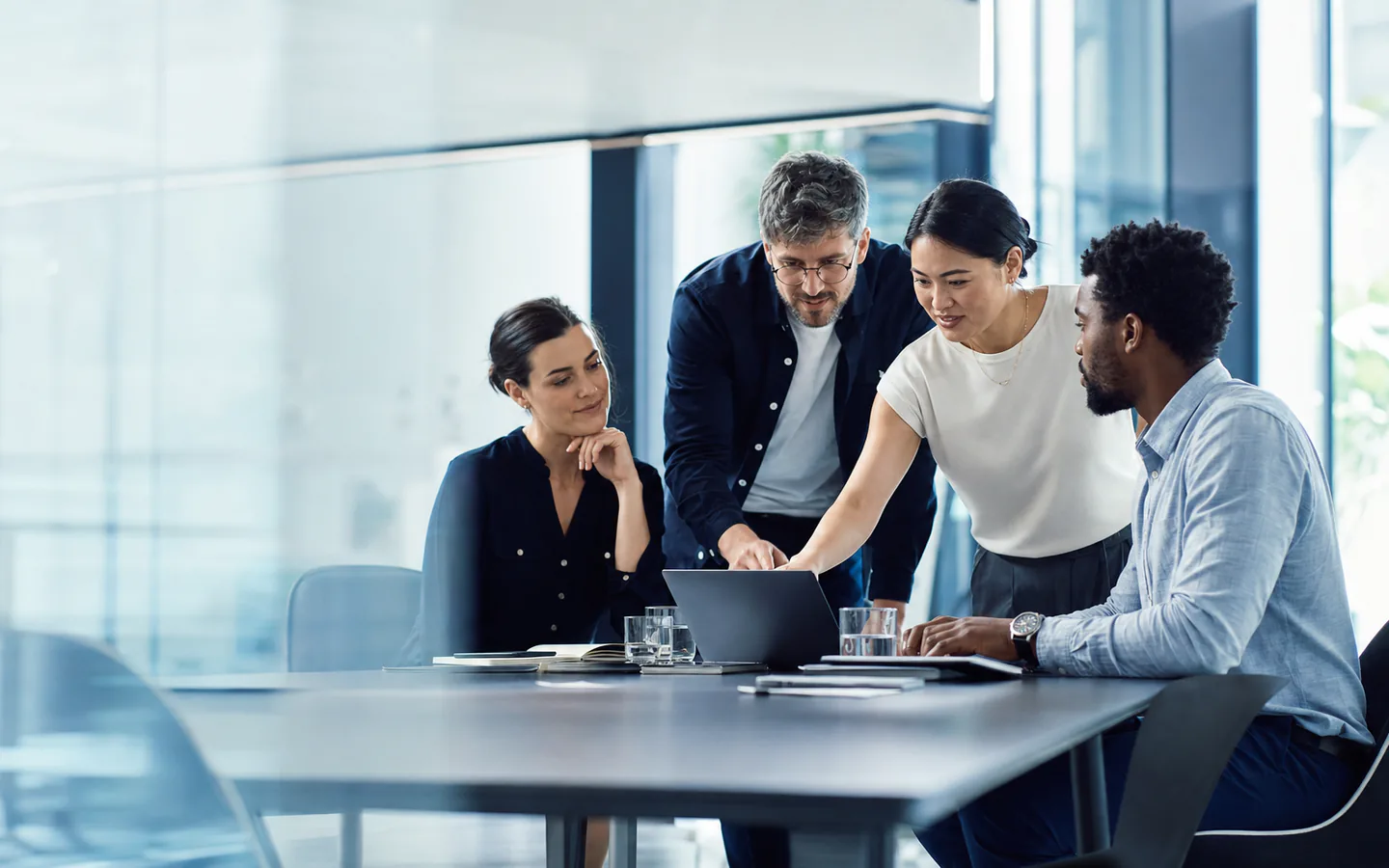 A diverse technology team collaborating in a modern workspace